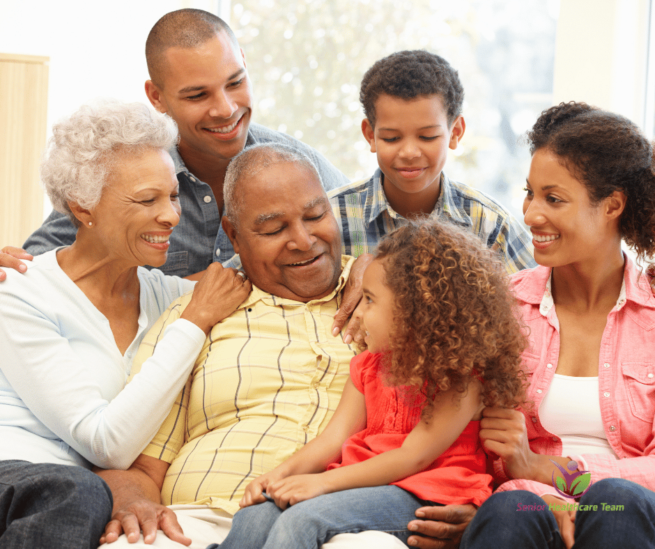 A happy multi-generational family sitting together on a couch.