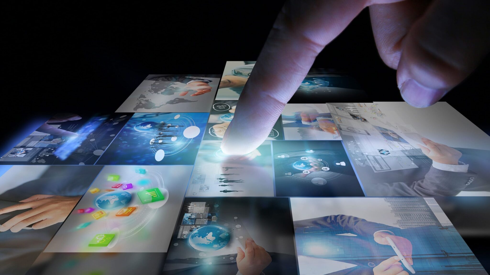 A finger touching a digital screen displaying a grid of profile images.